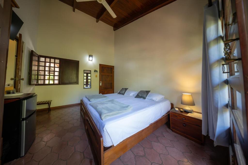 Postel nebo postele na pokoji v ubytování Hotel Villa Del Sol