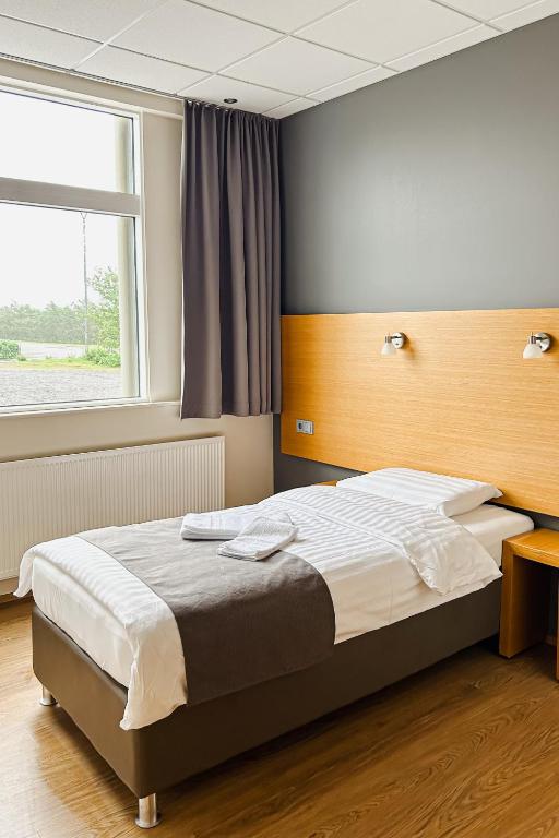 Postel nebo postele na pokoji v ubytování Hotel Jökull