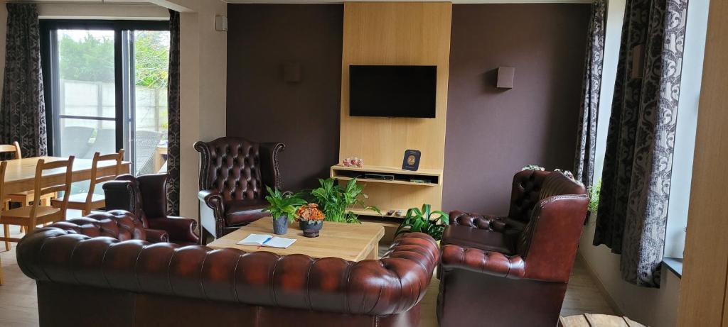 TV a/nebo společenská místnost v ubytování B&B D'Hollehoeve
