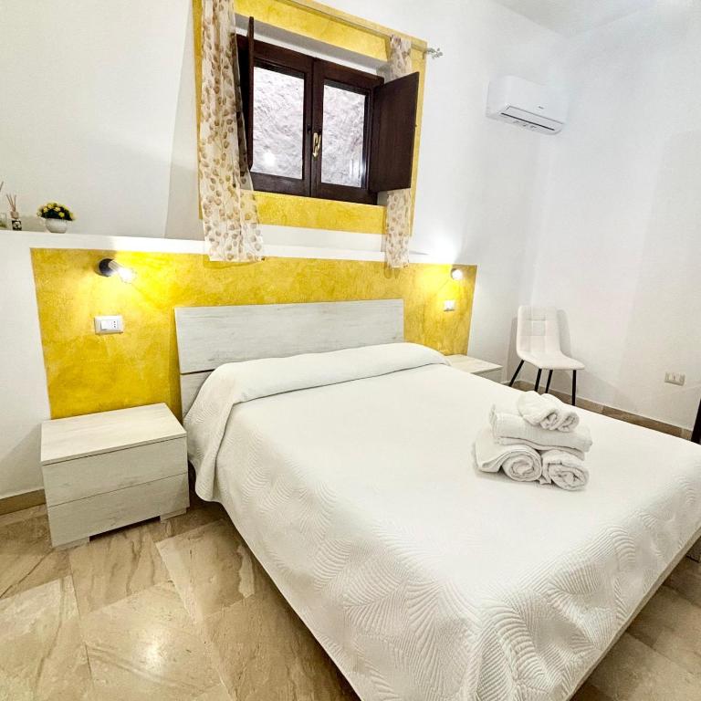 Ένα ή περισσότερα κρεβάτια σε δωμάτιο στο CASA DEL CORSO