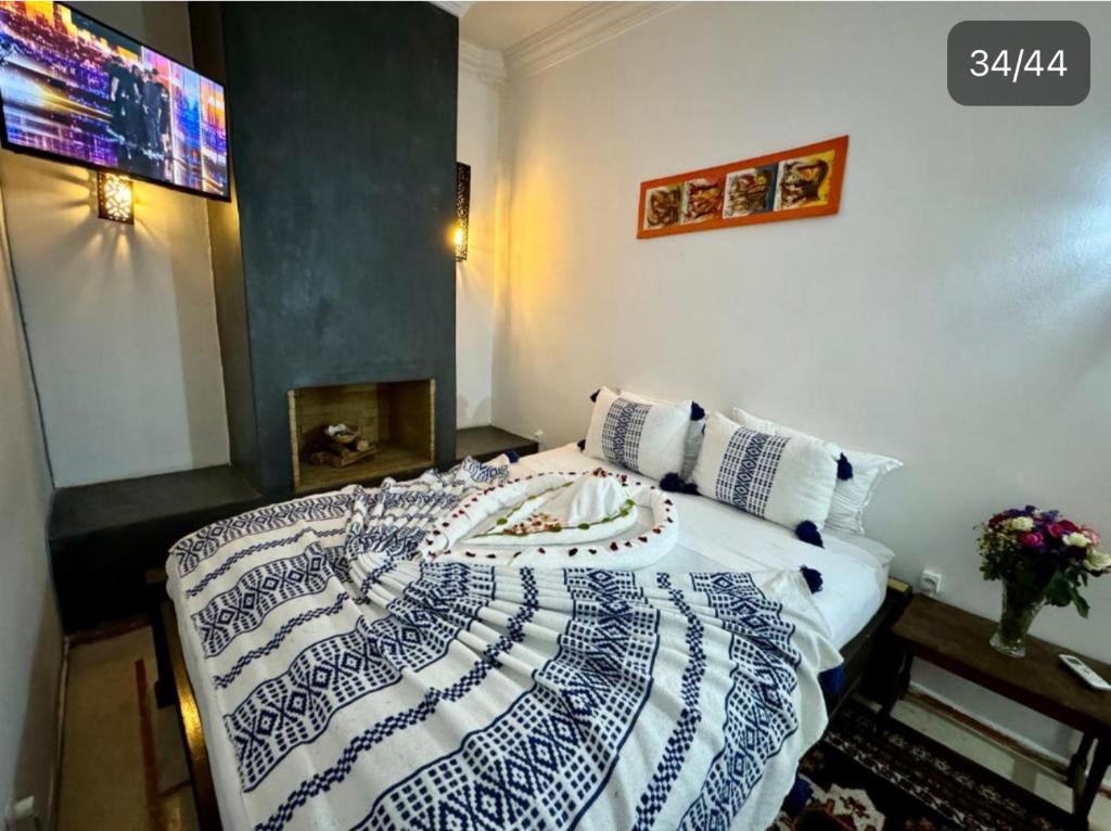 Postel nebo postele na pokoji v ubytování Riad Iklil