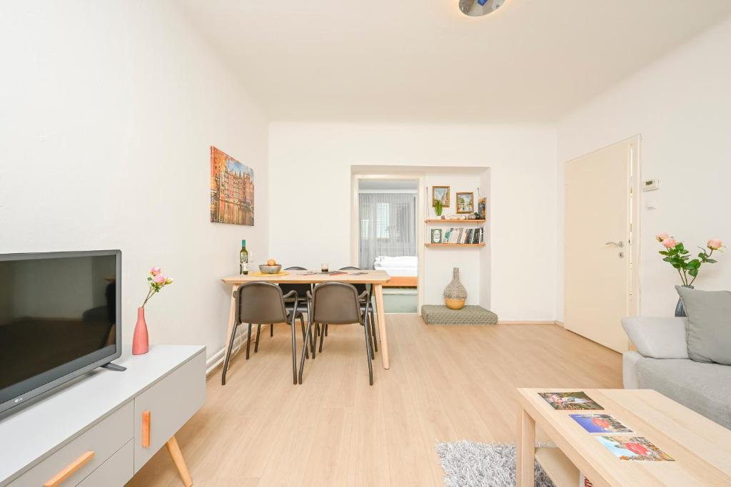 Televízia a/alebo spoločenská miestnosť v ubytovaní Szene Wien Apartment