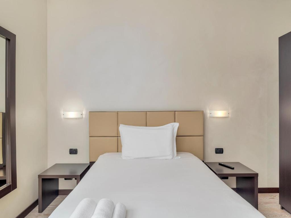 Postel nebo postele na pokoji v ubytování B&B HOTEL Park Hotel Cassano