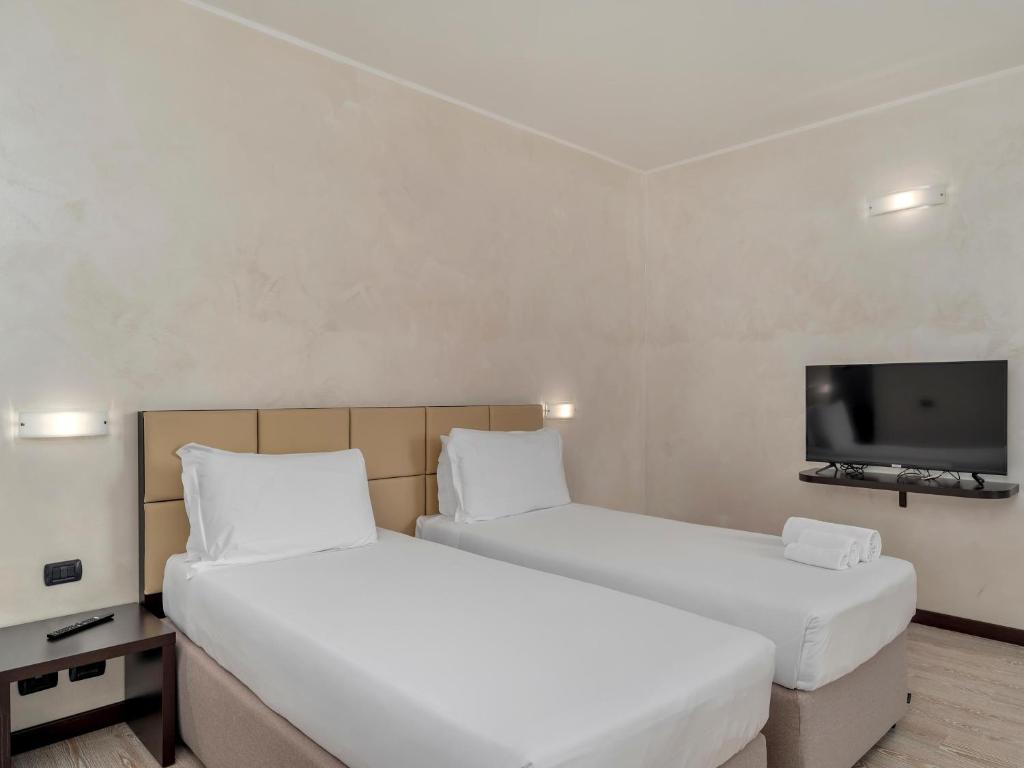 Postel nebo postele na pokoji v ubytování B&B HOTEL Park Hotel Cassano