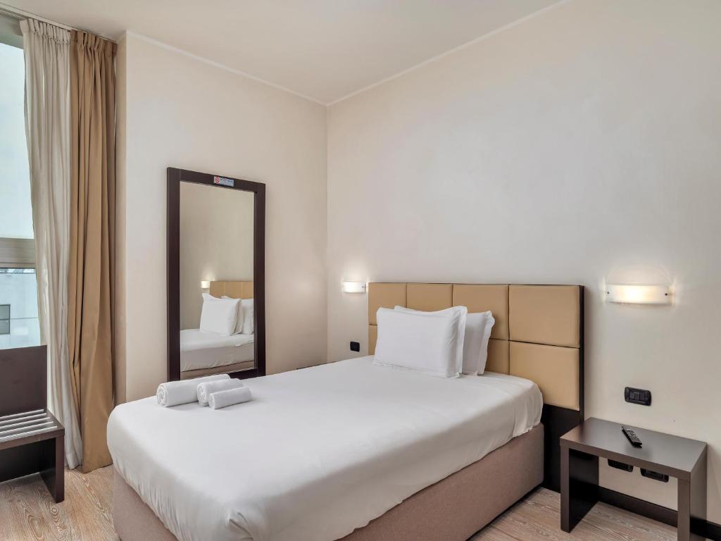 Postel nebo postele na pokoji v ubytování B&B HOTEL Park Hotel Cassano