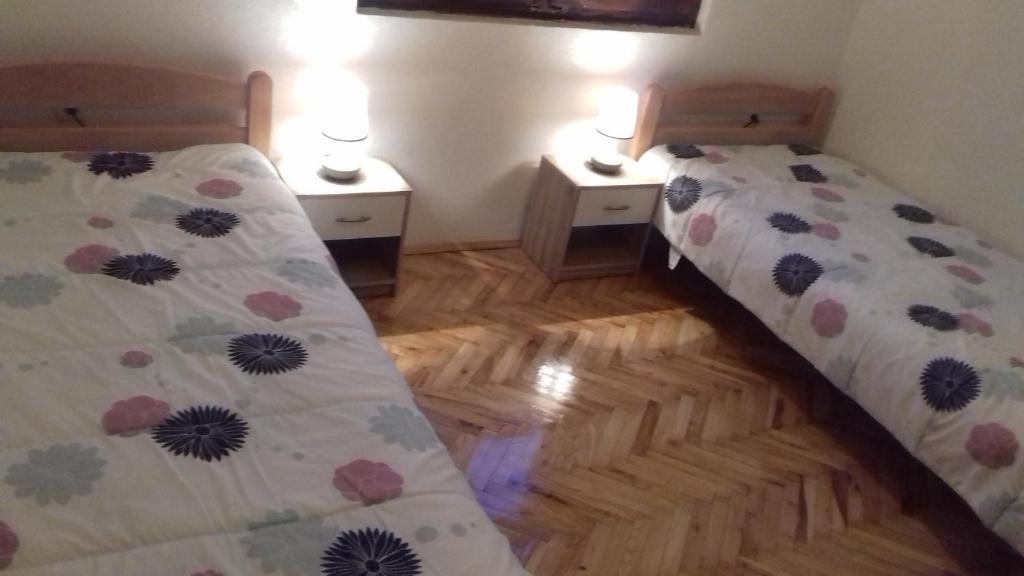 Postel nebo postele na pokoji v ubytování Andrić