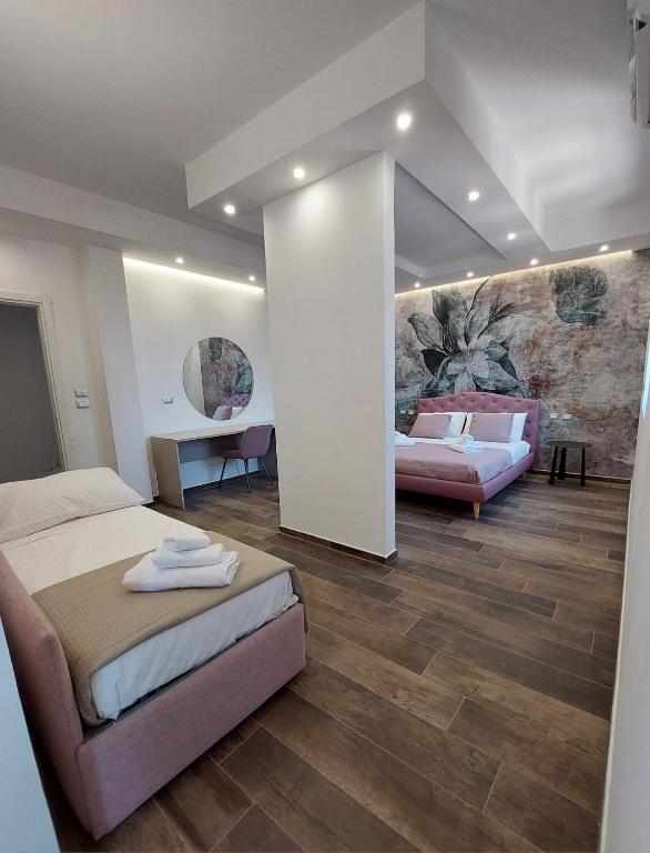 Postel nebo postele na pokoji v ubytování Dimora Gentile Lecce B&B