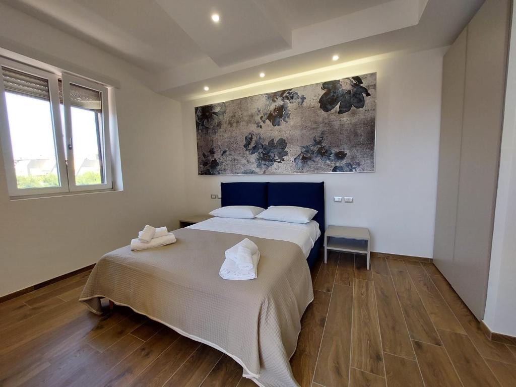Postel nebo postele na pokoji v ubytování Dimora Gentile Lecce B&B