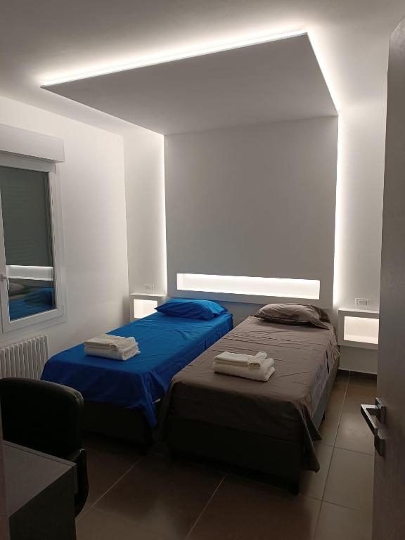 Postel nebo postele na pokoji v ubytování CIVICO 14 Holiday Rooms