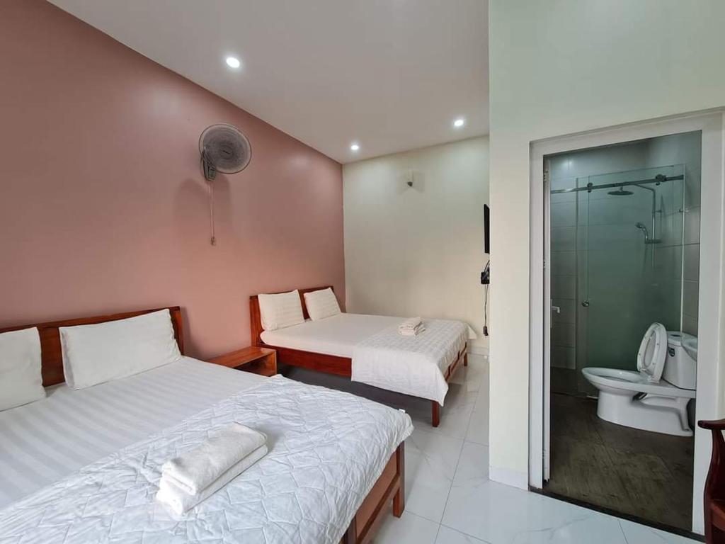 Postel nebo postele na pokoji v ubytování Motel Happy House Nhơn Trạch
