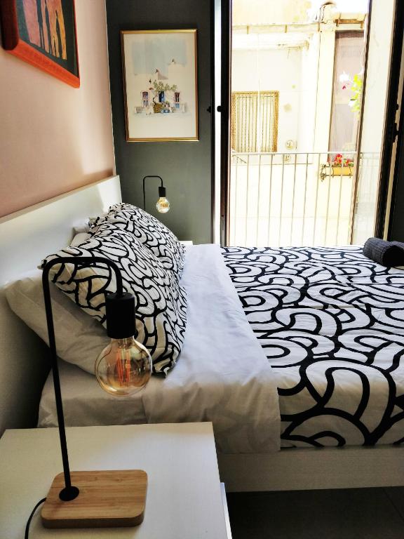 Postel nebo postele na pokoji v ubytování Kalos Rooms