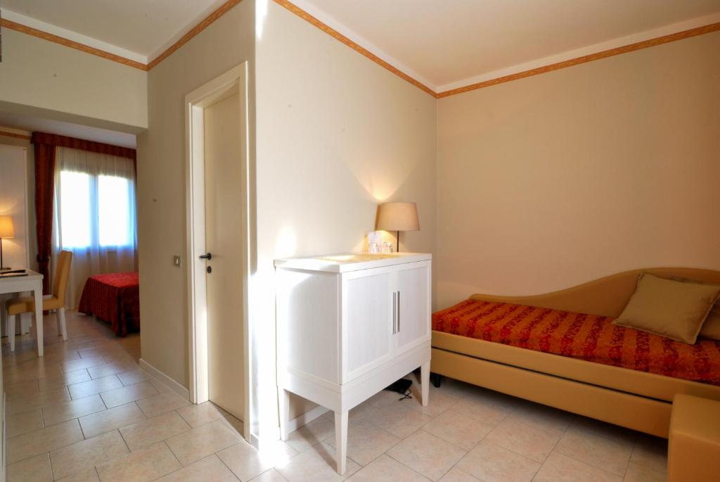 Postel nebo postele na pokoji v ubytování Hotel Eden Salò