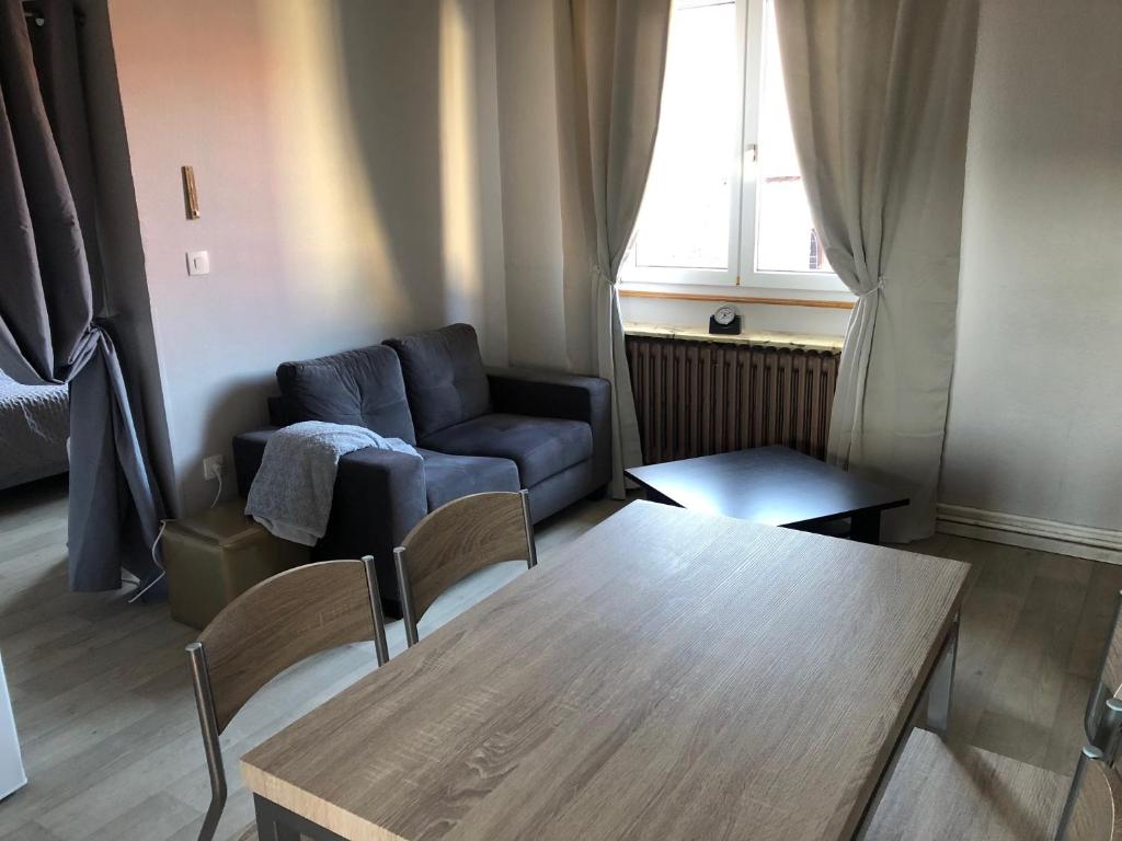 Posezení v ubytování Appartement à l'ange