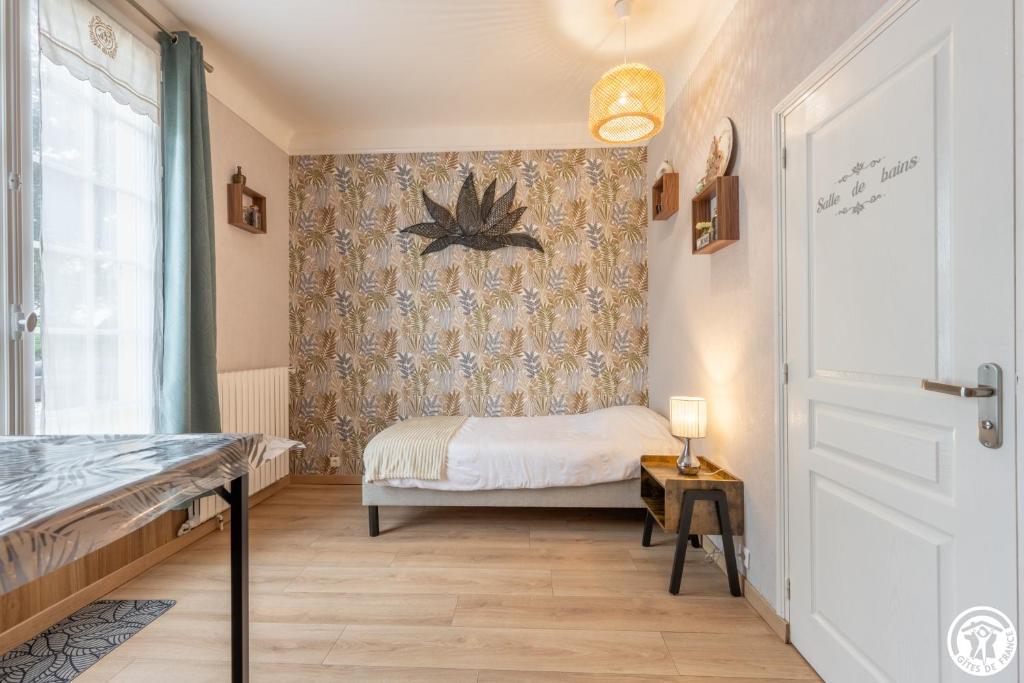Postel nebo postele na pokoji v ubytování B&B Au bois dormant chambres d hotes
