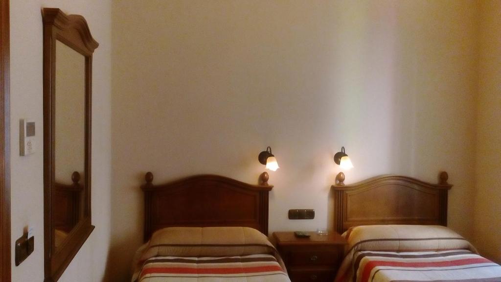 Voodi või voodid majutusasutuse Hostal Granada toas