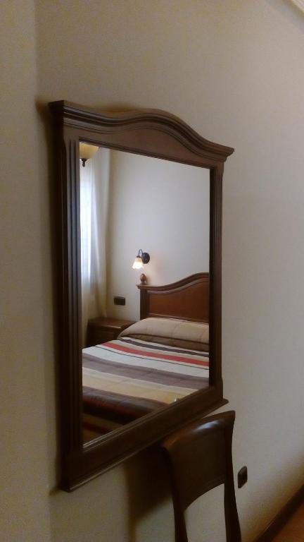 Voodi või voodid majutusasutuse Hostal Granada toas
