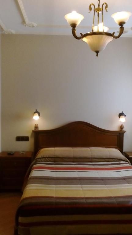 Voodi või voodid majutusasutuse Hostal Granada toas