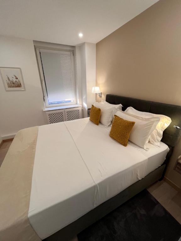 Postel nebo postele na pokoji v ubytování AppartHôtel Elite Spa