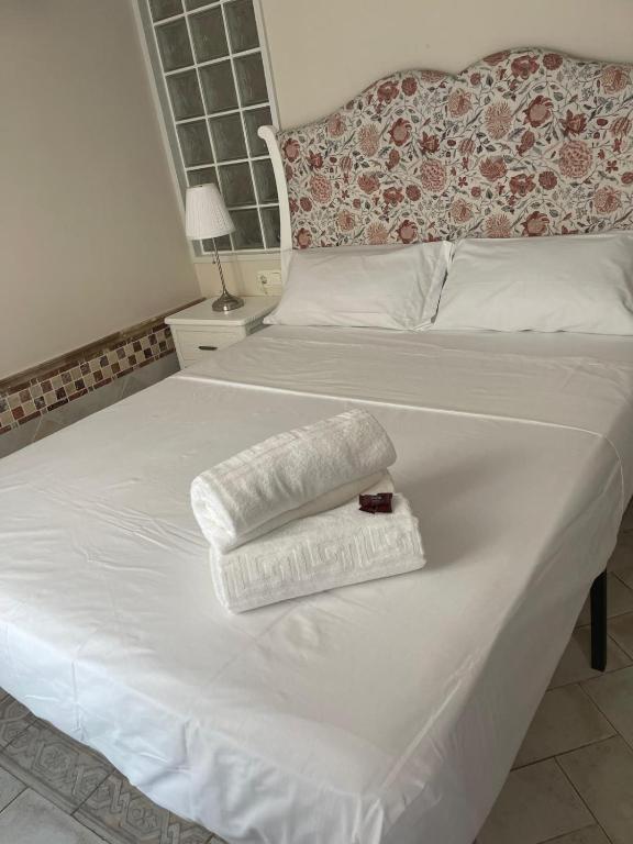 Una cama o camas en una habitación de Casa bella