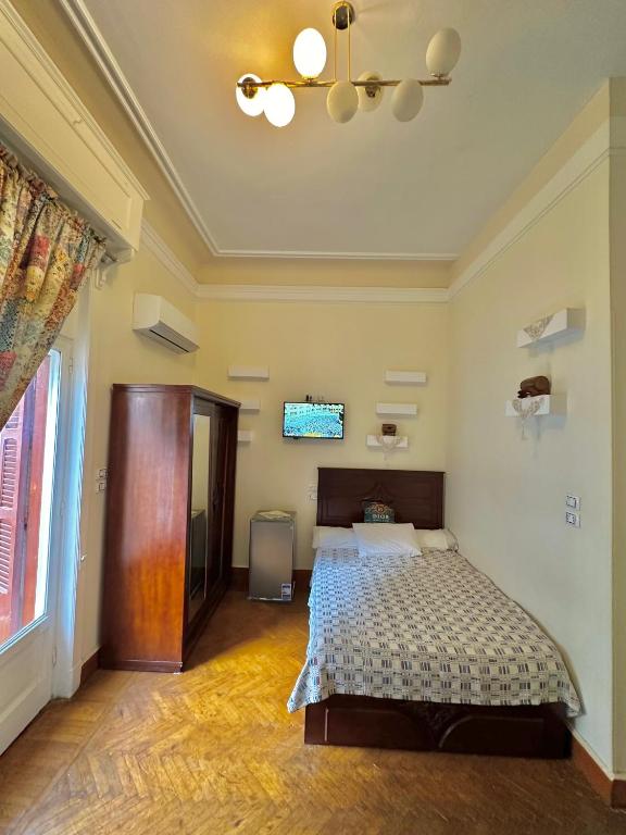 Postel nebo postele na pokoji v ubytování Dior Hotel Downtown