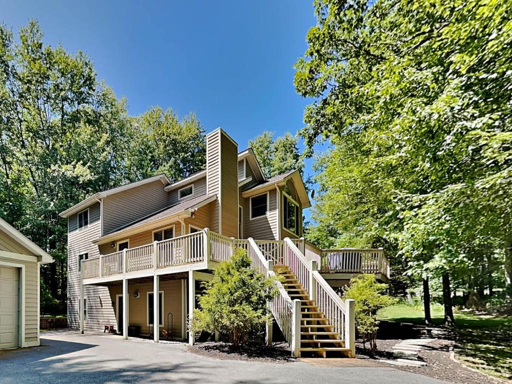 a large house with stairs leading up to it at Black Bear Lodge in Oakland