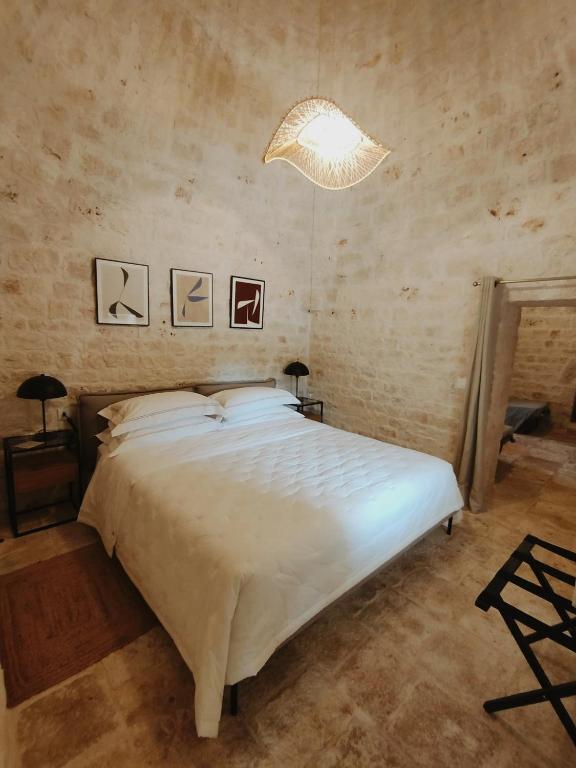 A bed or beds in a room at Villa Torre Bianca by Emily Hotels