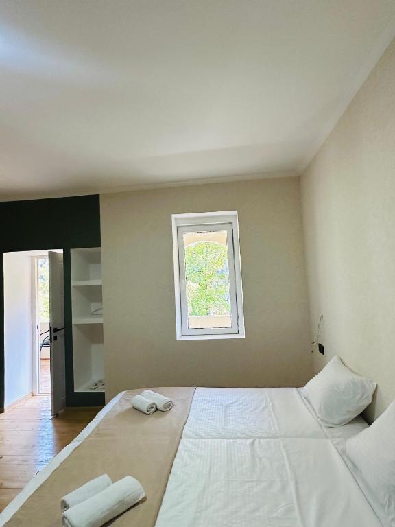 Postel nebo postele na pokoji v ubytování Family Hotel - White House Racha