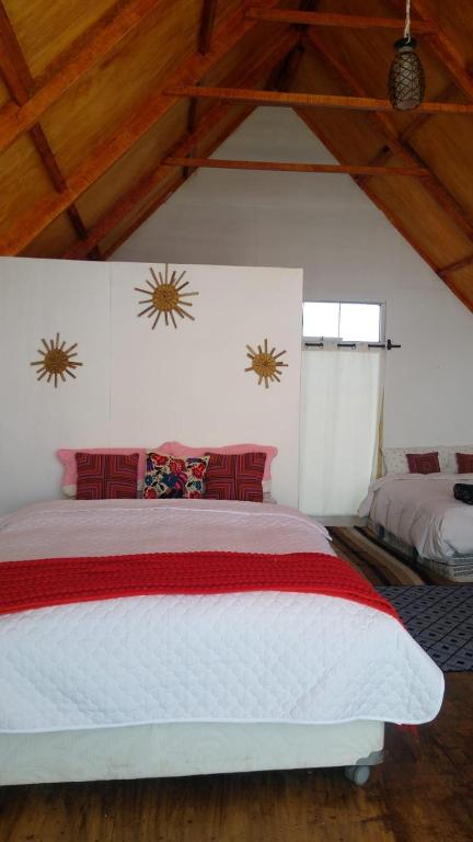 Postel nebo postele na pokoji v ubytování Titicaca wasy lodge