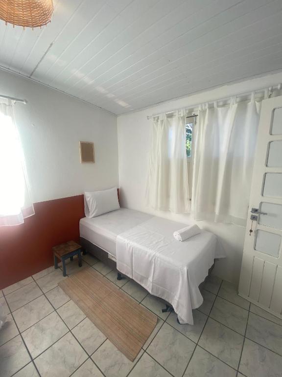 Postel nebo postele na pokoji v ubytování Vilare Pousada