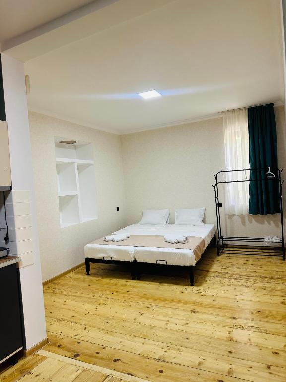 Postel nebo postele na pokoji v ubytování Family Hotel - White House Racha