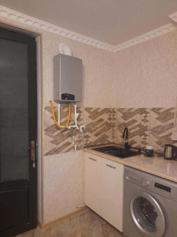 Kuchyň nebo kuchyňský kout v ubytování Gest House Mariami