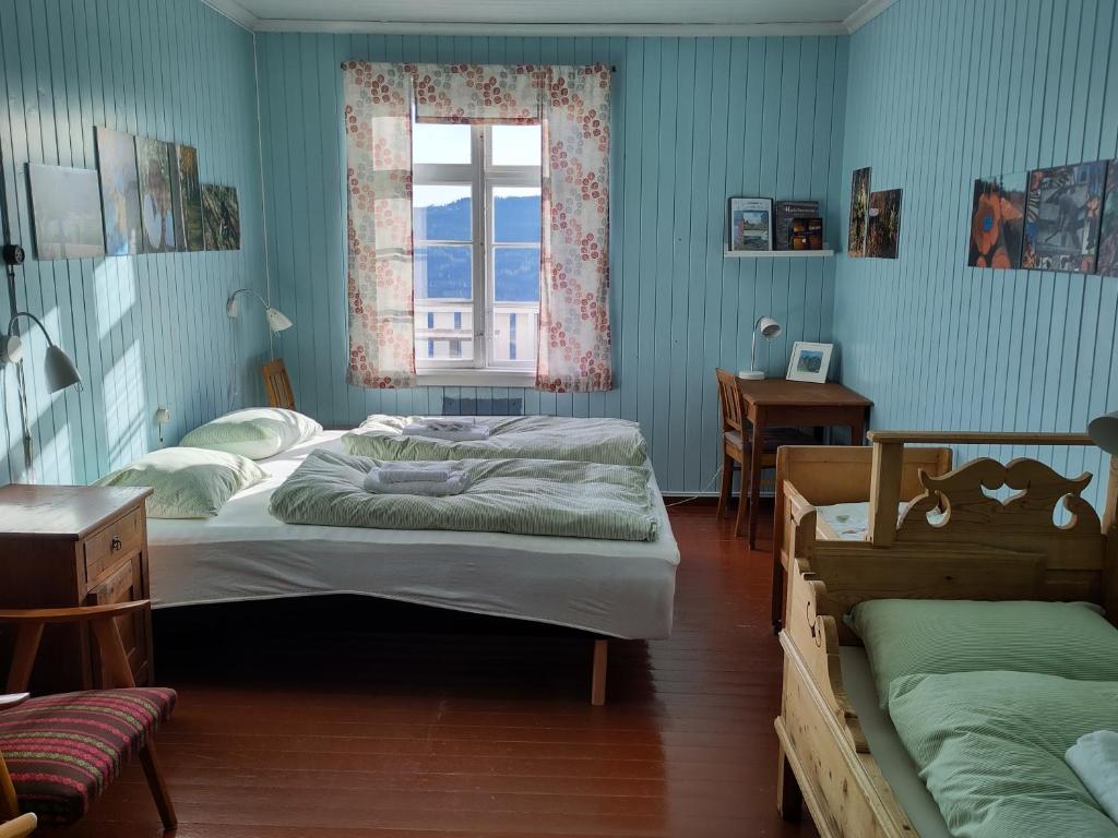 Postel nebo postele na pokoji v ubytování Granum Gård