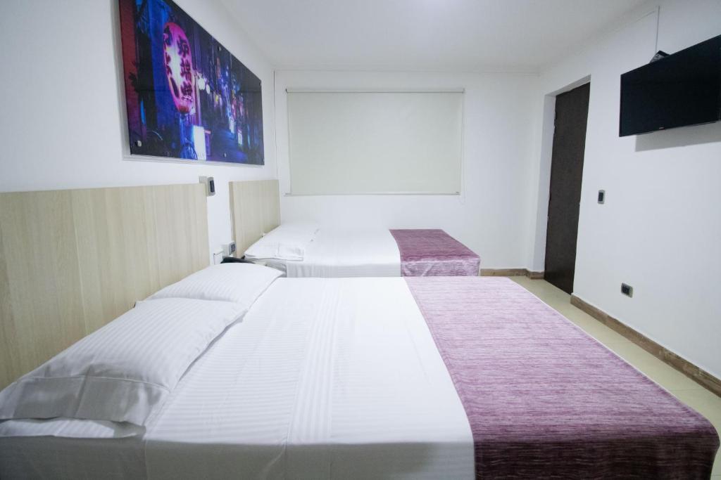 Postel nebo postele na pokoji v ubytování Hotel Boutique Street 50