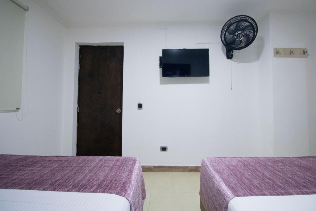 Postel nebo postele na pokoji v ubytování Hotel Boutique Street 50