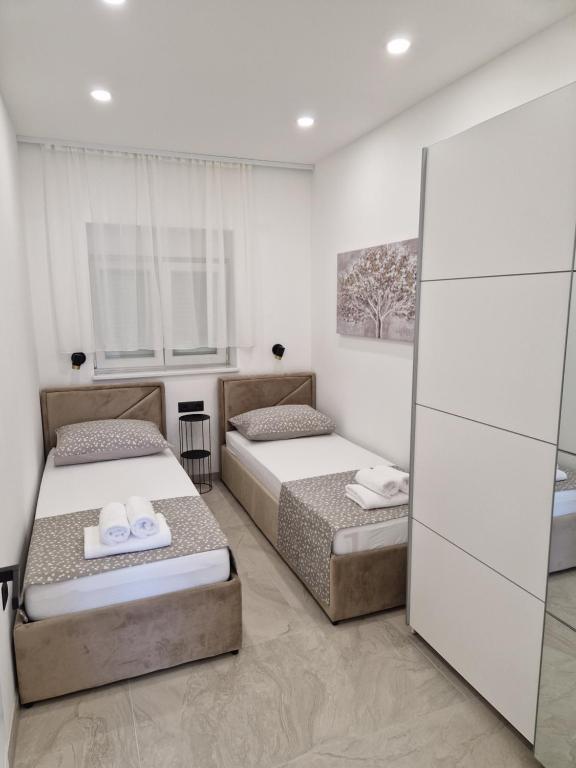 Posteľ alebo postele v izbe v ubytovaní Lavanda Centar Makarska