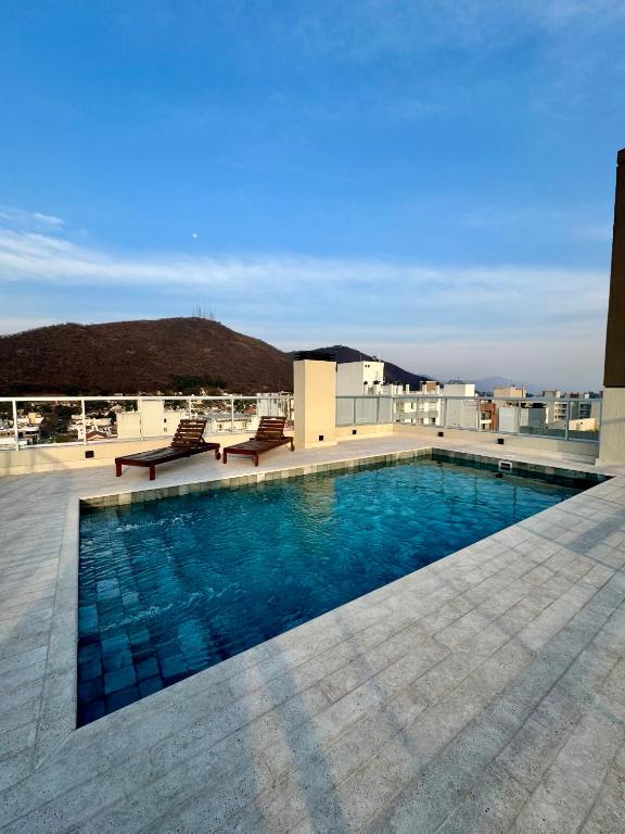 a swimming pool on the roof of a building at Augusto Apart 4 in Salta