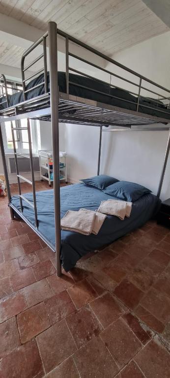 Posteľ alebo postele v izbe v ubytovaní Maison de Vacances 8 à 15 pers à proximité du Canal du Midi