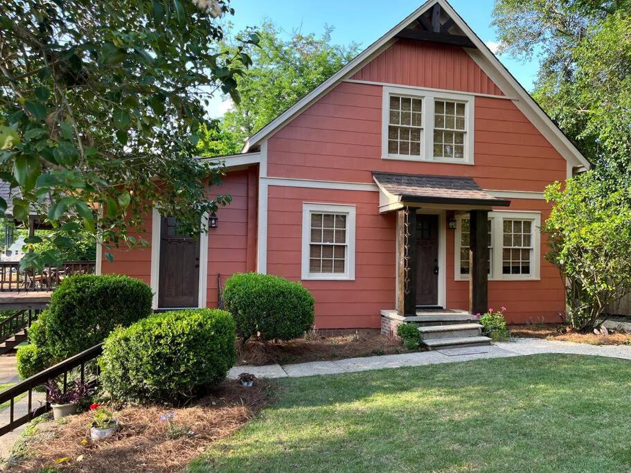 a red house with a porch and a yard at Jenny's Cottage WPool 3 Blocks from Downtown in Laurel