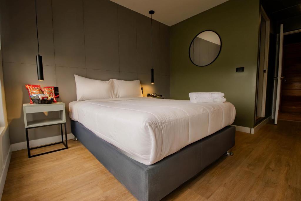 Postel nebo postele na pokoji v ubytování Miraflores Suites Centro