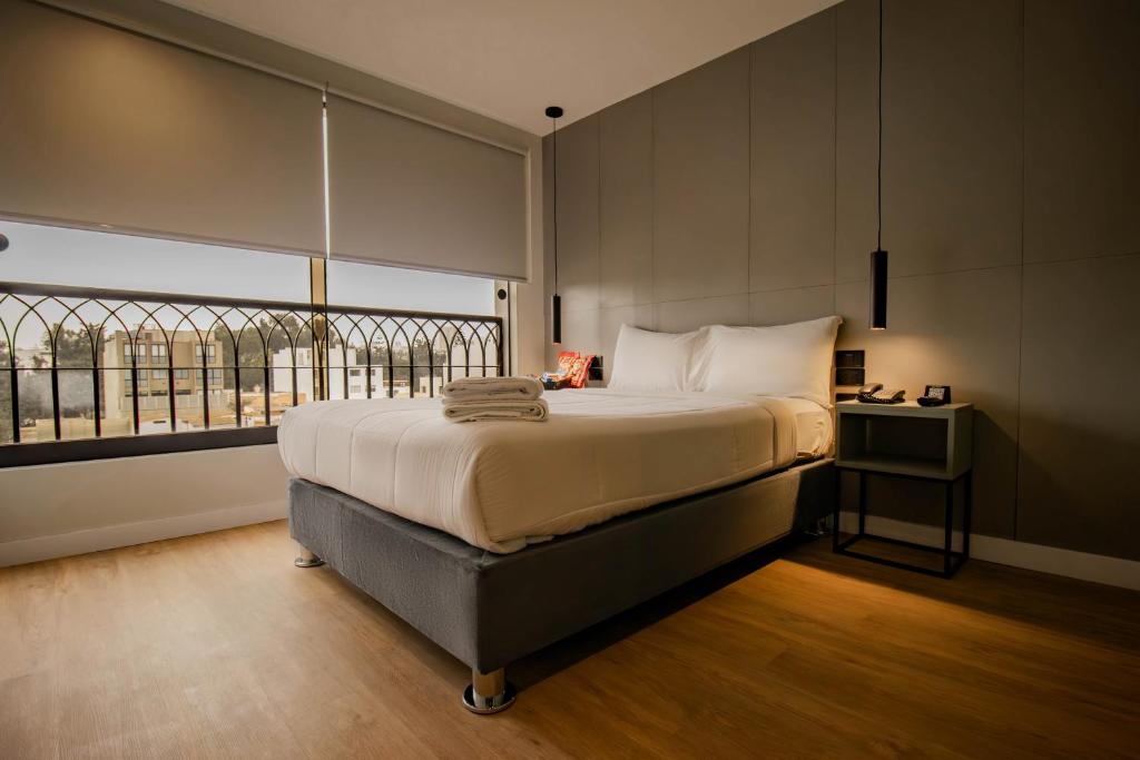 Postel nebo postele na pokoji v ubytování Miraflores Suites Centro