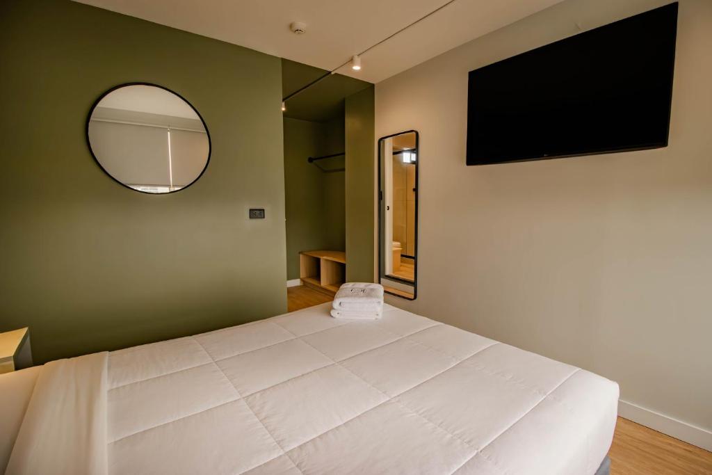 TV a/nebo společenská místnost v ubytování Miraflores Suites Centro