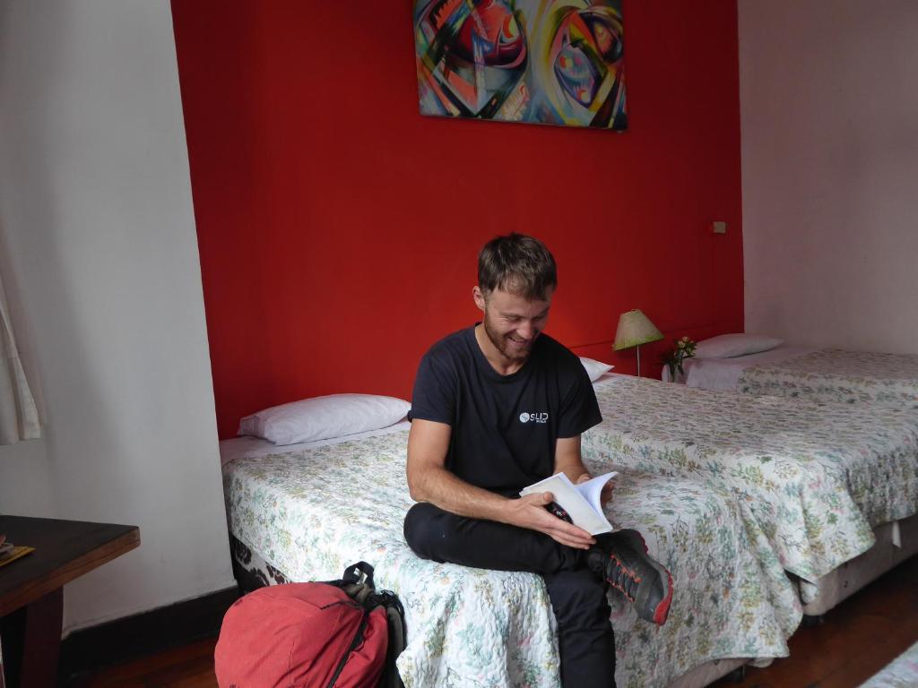 Postel nebo postele na pokoji v ubytování Nómada Eco-Hostal