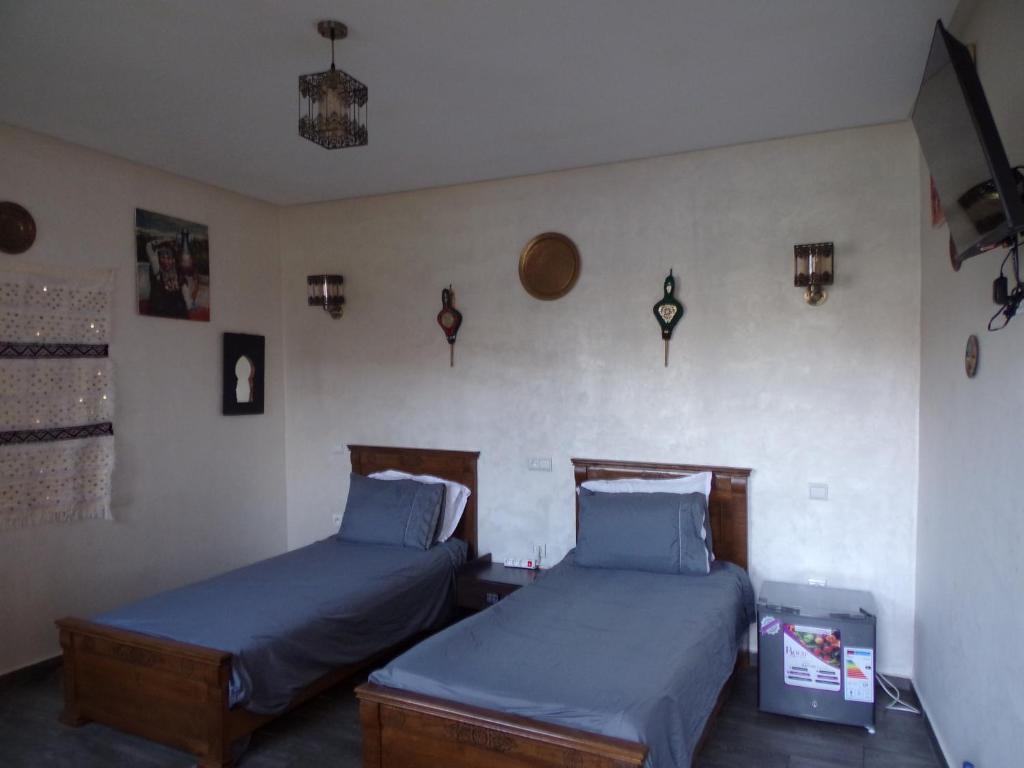 Postel nebo postele na pokoji v ubytování Jnane Ville Verte