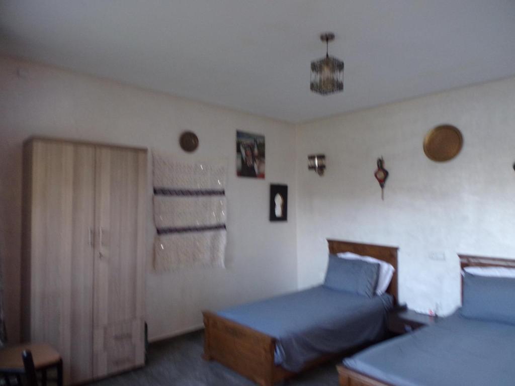 Postel nebo postele na pokoji v ubytování Jnane Ville Verte
