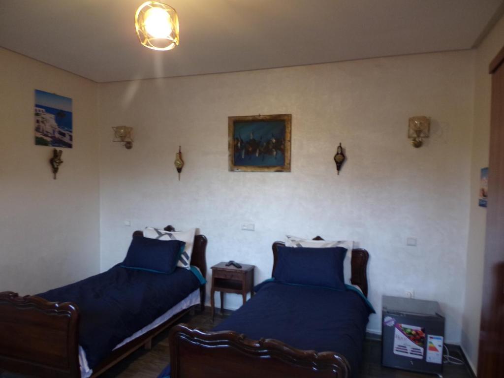 Postel nebo postele na pokoji v ubytování Jnane Ville Verte