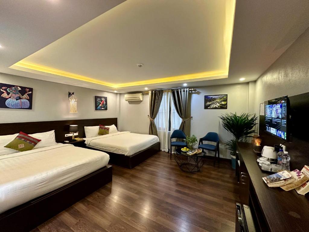 Postel nebo postele na pokoji v ubytování HeLLo Sapa Hotel