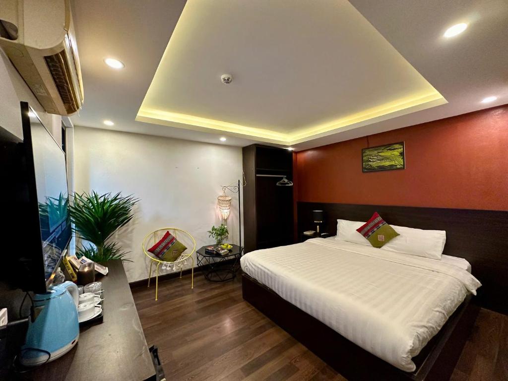 Postel nebo postele na pokoji v ubytování HeLLo Sapa Hotel
