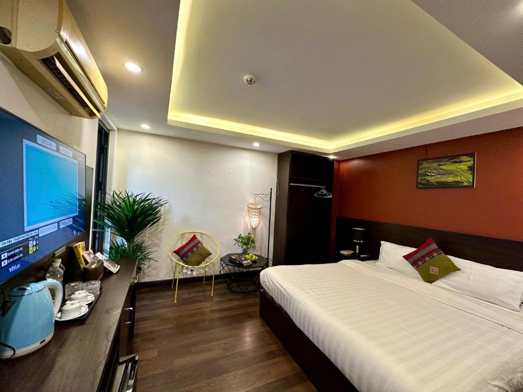 Postel nebo postele na pokoji v ubytování HeLLo Sapa Hotel