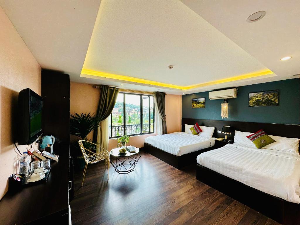Postel nebo postele na pokoji v ubytování HeLLo Sapa Hotel