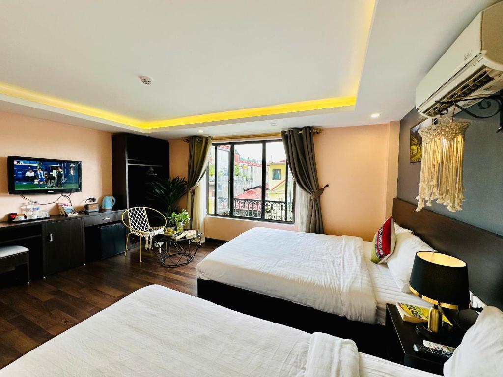 TV a/nebo společenská místnost v ubytování HeLLo Sapa Hotel